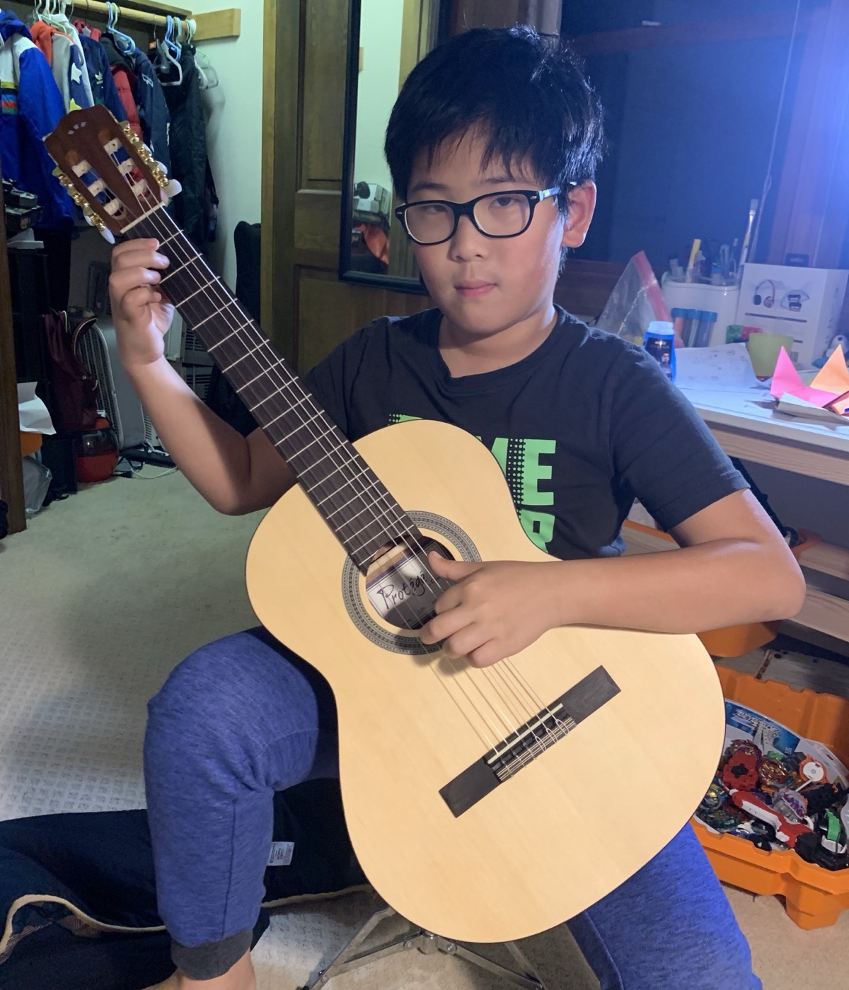 YangMing at eight with his first classical guitar